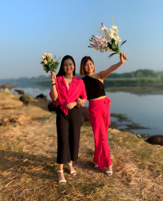 Sisters outdoor photoshoot holding flowers