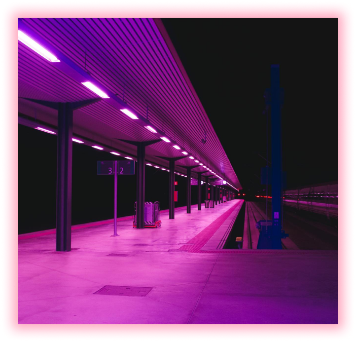 Train platform with pink neon lighting